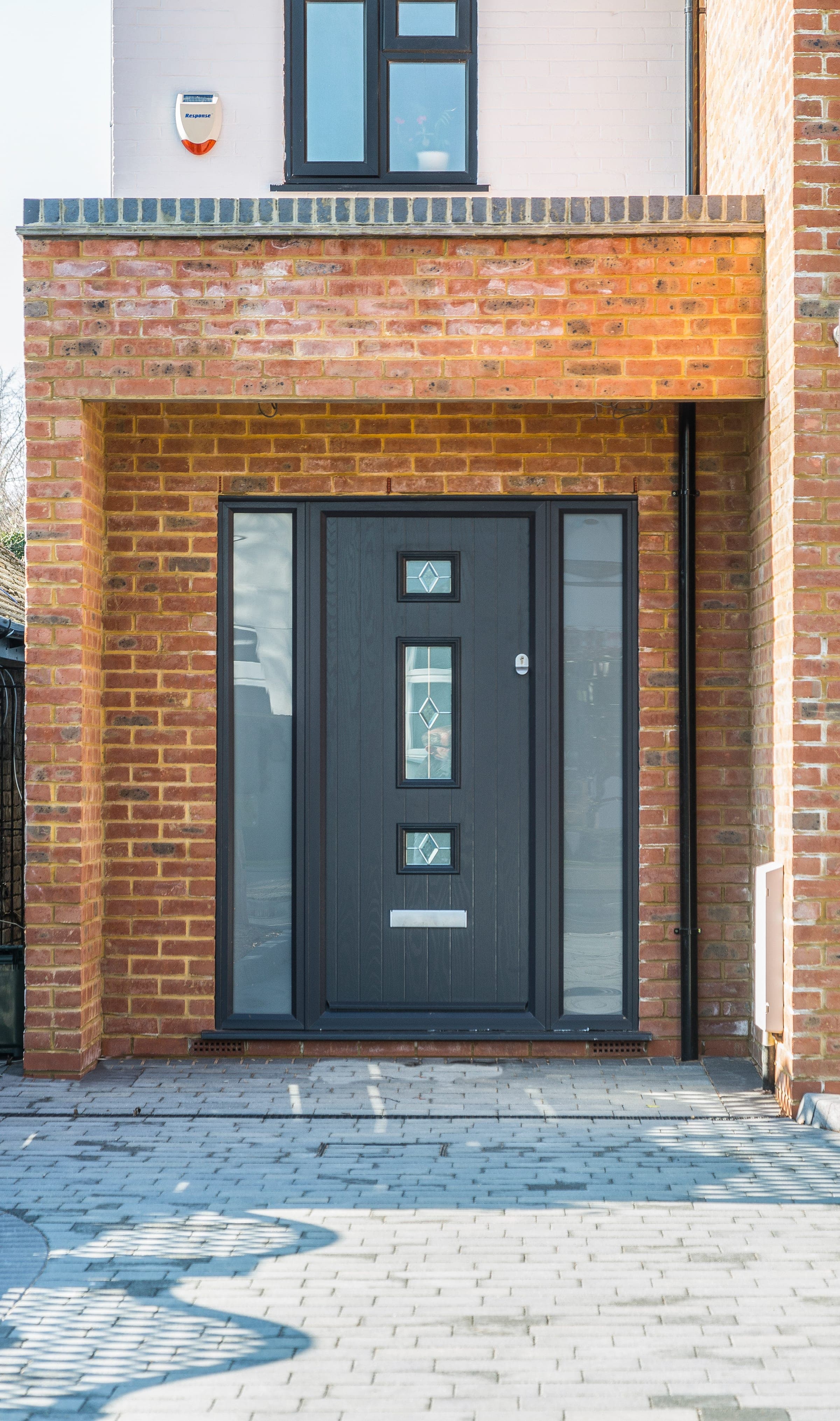 Anthracite composite front door with brick surround, Pinner.