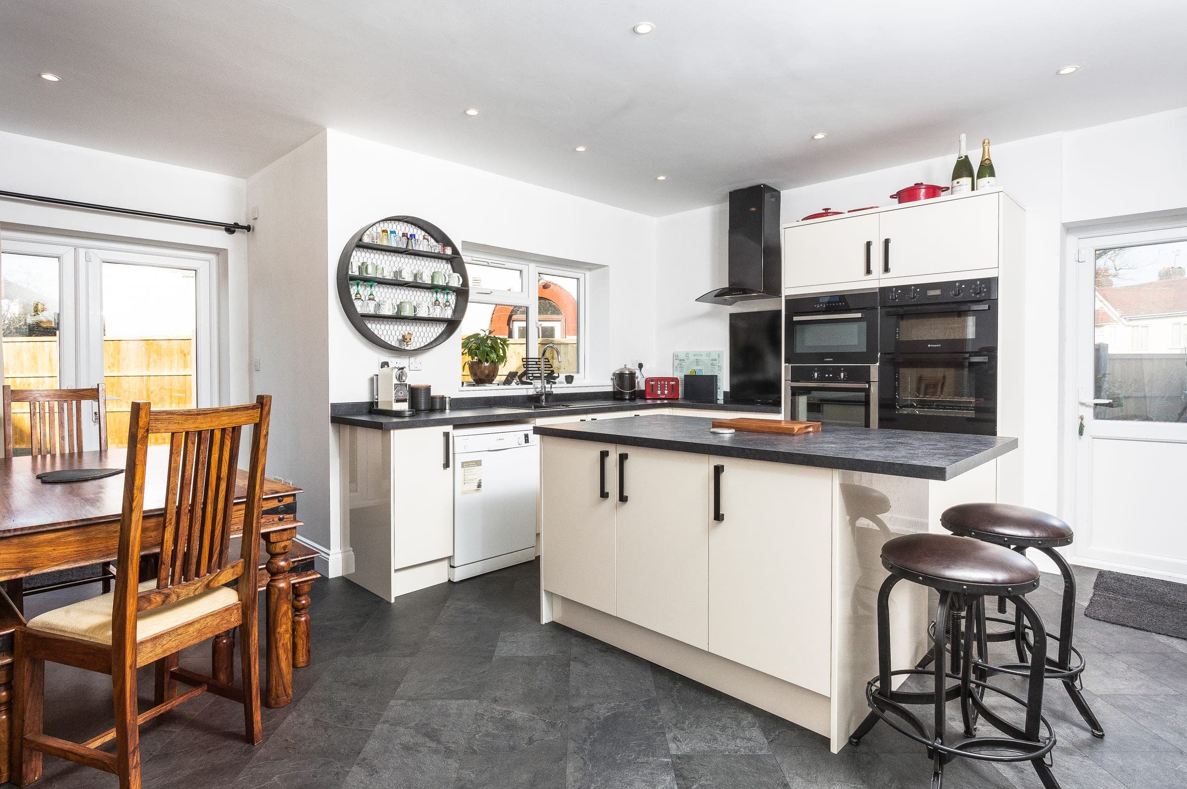 Kitchen. Round wire shelving and integrated appliances