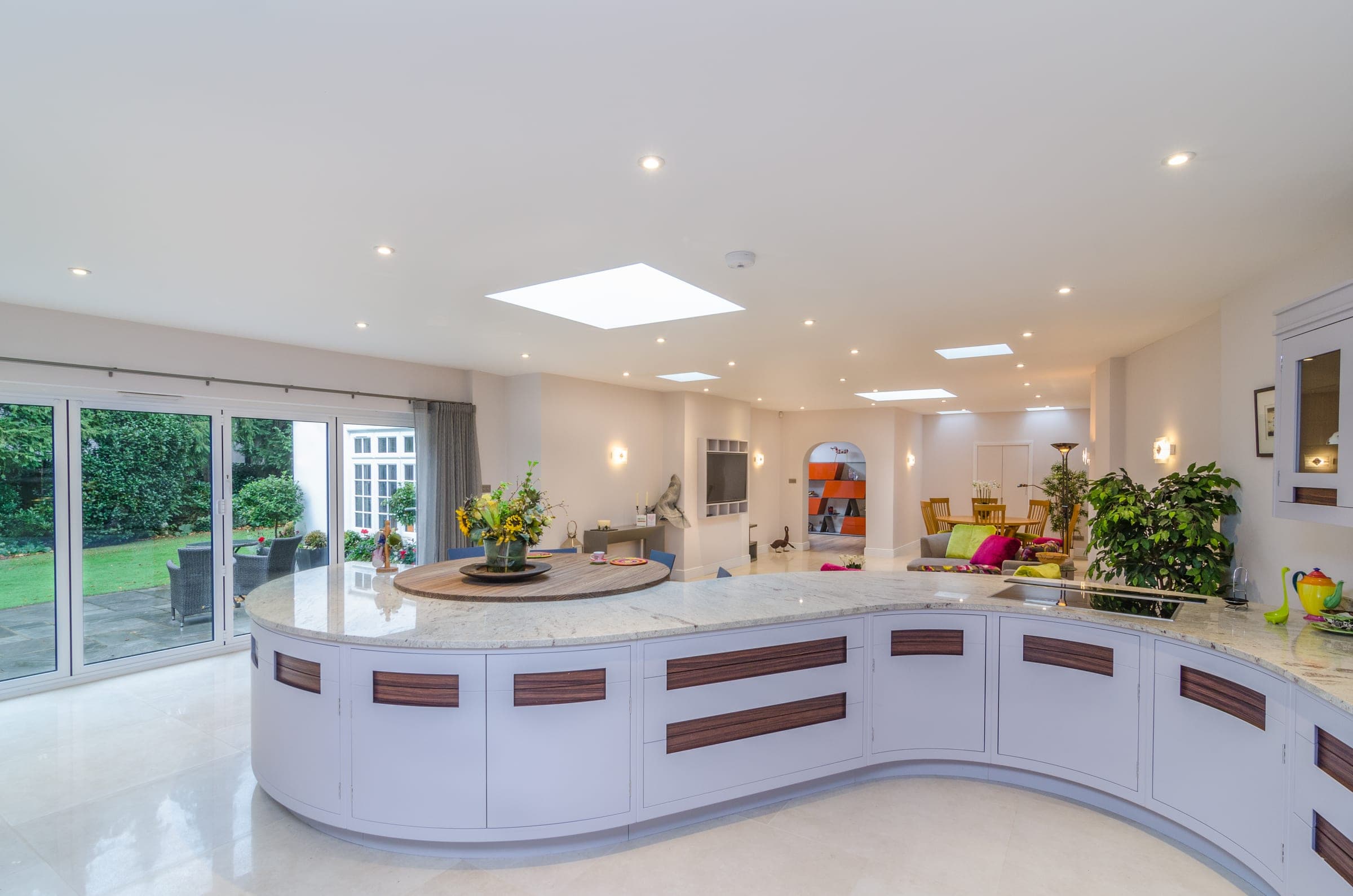 Kitchen island with granite work surface and integrated hob, Vicarage Way.
